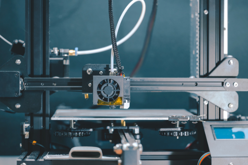 Close-up of an industrial 3D printer used for creating detailed manufacturing animations, illustrating complex assembly line procedures and safety protocols for employee training.