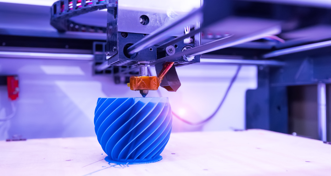 A 3D printer in action, creating a detailed blue object with a spiral design, showcasing EXPOSIT's expertise in converting digital models into precise physical prototypes for testing and manufacturing.